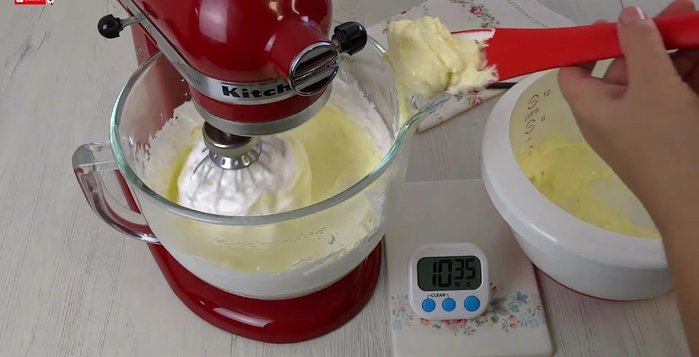 Add the softened butter to the meringue and beat until fully combined.