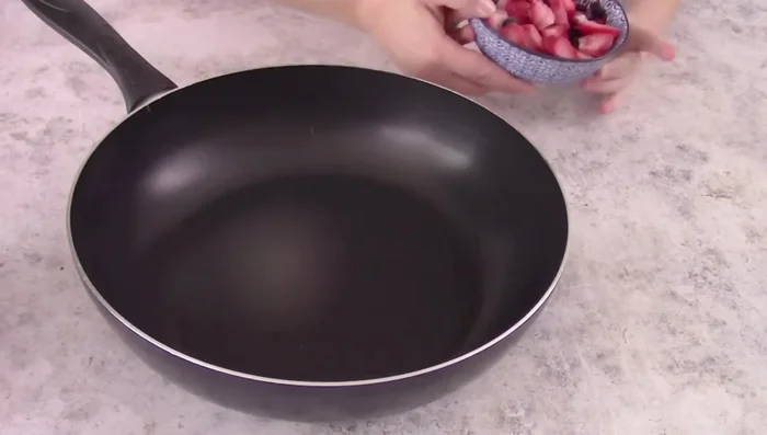 Make the berry sauce: Simmer 150g frozen berries with 2 spoons of sugar until thickened.