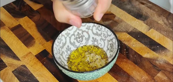 Season the zucchini slices with olive oil, salt, pepper, garlic, and other spices if desired.