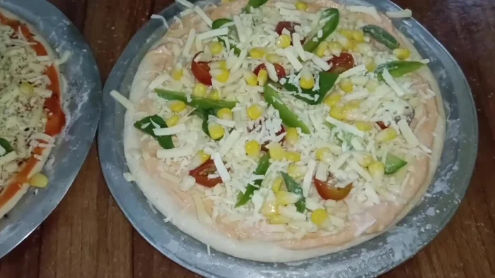 Apply milk wash to both pizzas. Bake at 230°C for 20 minutes, flipping halfway through.