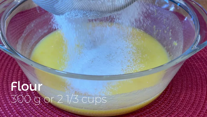 In a separate bowl, whisk together cake flour and baking powder.