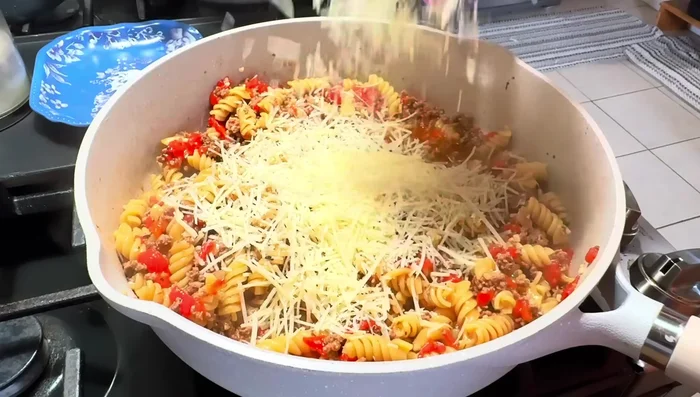 Stir in 5 oz of Parmesan cheese and 1 cup of heavy cream. Stir until well combined.