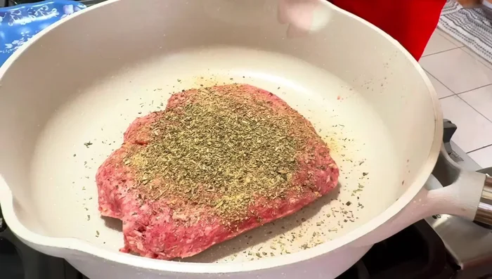 Add 1/2 cup of diced Vidalia onions and cook until the beef is browned and no longer pink. Drain excess grease using paper towels.