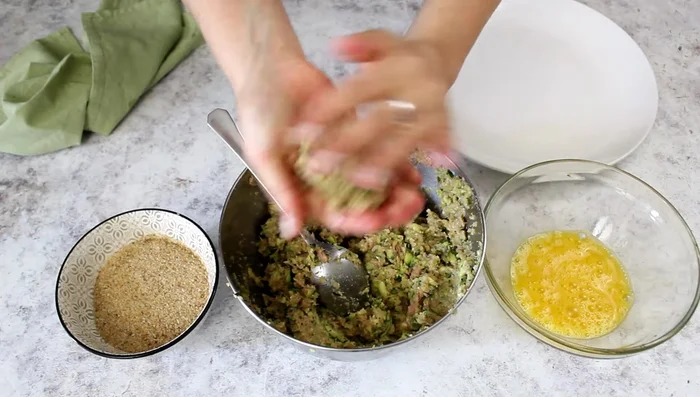Shape the mixture into meatballs. Dip each meatball in beaten egg (optional) and breadcrumbs.