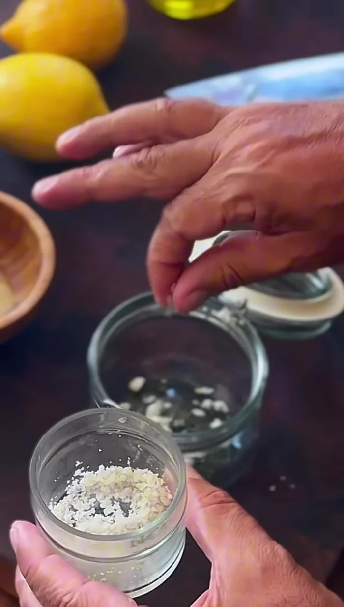 Add 1/4 teaspoon of salt and 1/4 teaspoon of black pepper to the jar.