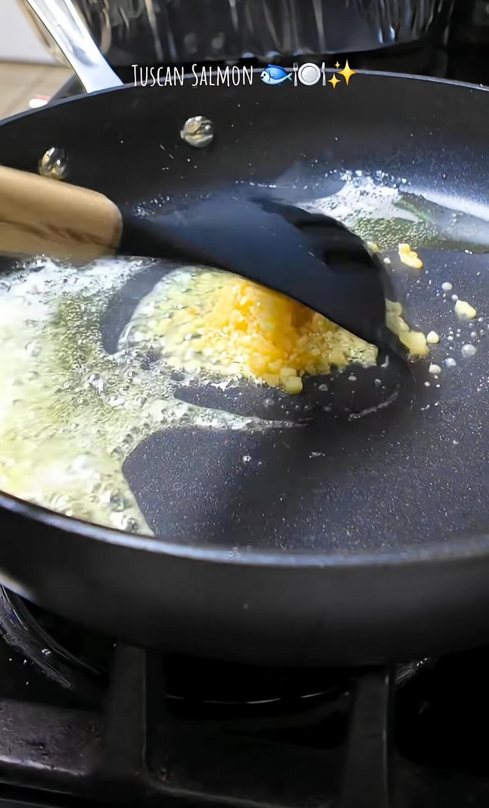 Melt butter in a pan, add minced garlic, and heavy cream. Season to taste.