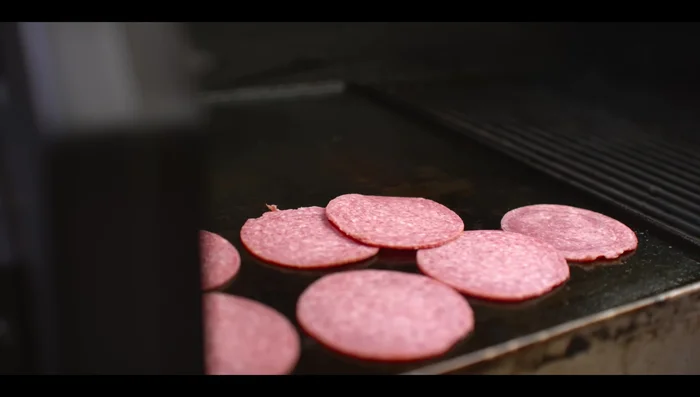 Grill salami, pepperoni, and ham on the pellet grill until slightly crisp. (28.4)