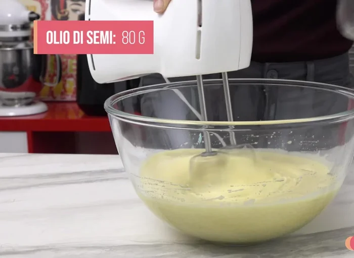 Add 80g of seed oil and whisk.
