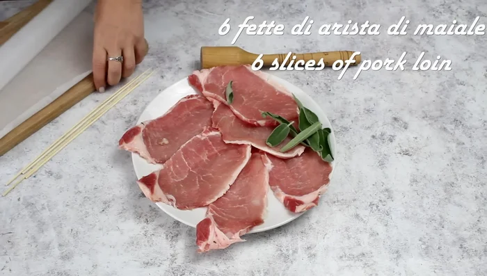 Flatten pork loin slices between baking paper using a meat tenderizer.