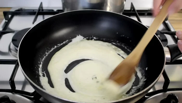 Add grated lemon peel and parmesan cheese at the end. Turn off heat and remove from heat.