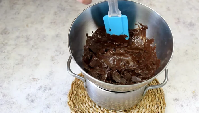Once the chocolate is melted, mix in the melted butter and sugar.
