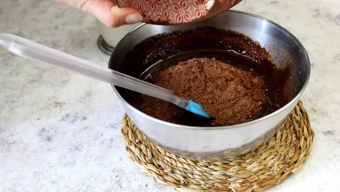 Add the cocoa powder and milk, mixing well.