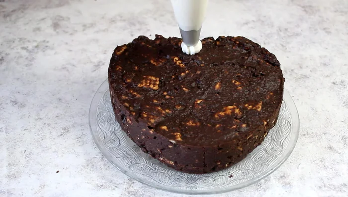 Pipe whipped cream around the edges of the cake to create a border.