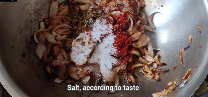 Add 1 teaspoon of oregano, 1/2 teaspoon of red chili powder, and salt to taste. Cook for another minute.