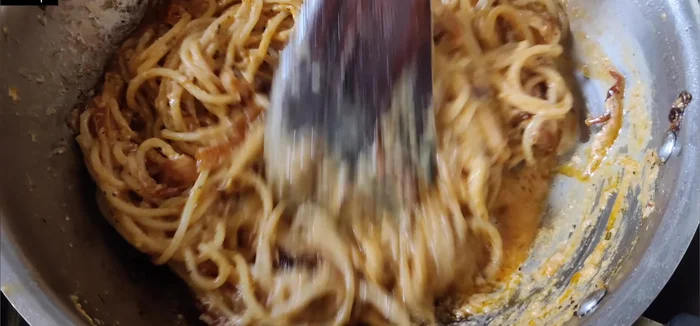 If needed, add 1/4 cup of reserved pasta water to adjust the sauce consistency and cook until thickened.