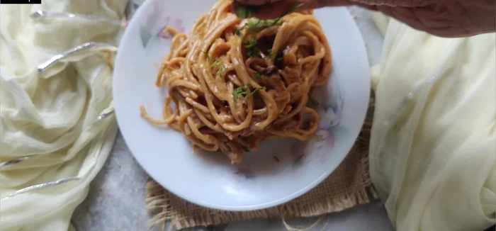 Remove from heat and serve hot. Garnish with parsley, grated cheese, or chili oil (optional).
