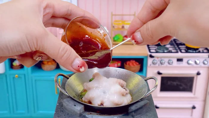 Add the octopus to the pan. Add spicy sauce and mix well.