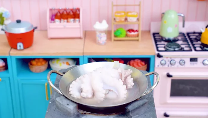 Transfer the octopus to a pot. Add cinnamon and lemon. Wait for 10 minutes.