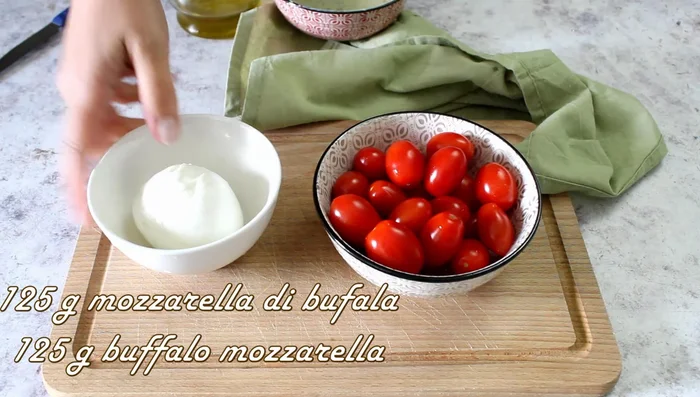 Cut 200g datterini tomatoes and 125g buffalo mozzarella into small pieces.