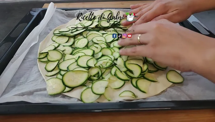 Arrange the courgette slices on the puff pastry, overlapping slightly.