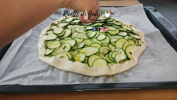 Use a serrated knife to lightly score the edges of the pastry.