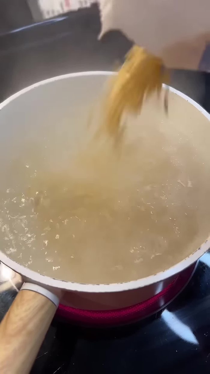 Drain two cans of tuna.