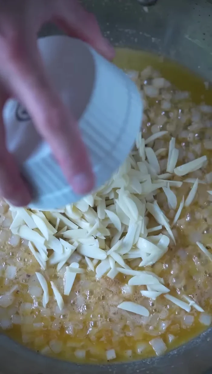 Add sliced garlic and cook low and slow until fragrant.