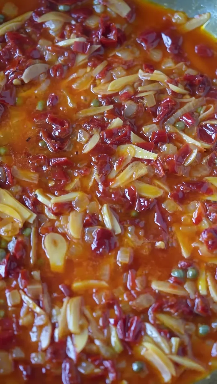 Add dry white wine, fresh thyme, fresh lemon juice, and cook down the sauce.