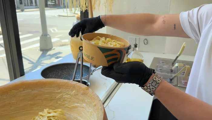 Divide the pasta into serving bowls.