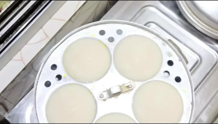 Steam the idlis until they are slightly cracked on top.