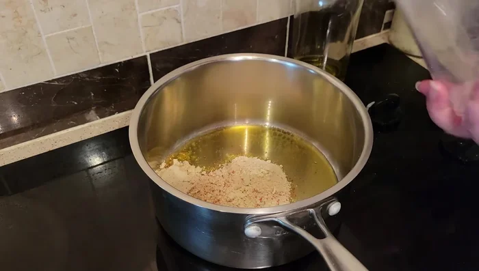 Heat olive oil in a pot for about 2 minutes.