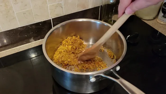 Add the blended vegetables to the pot and sauté for a couple of minutes.