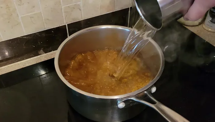 Add 6-8 cups of water and stir well.