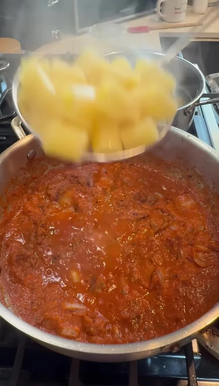 Add the cooked rigatoni to the sauce. Add a little pasta water at a time to loosen the dish.