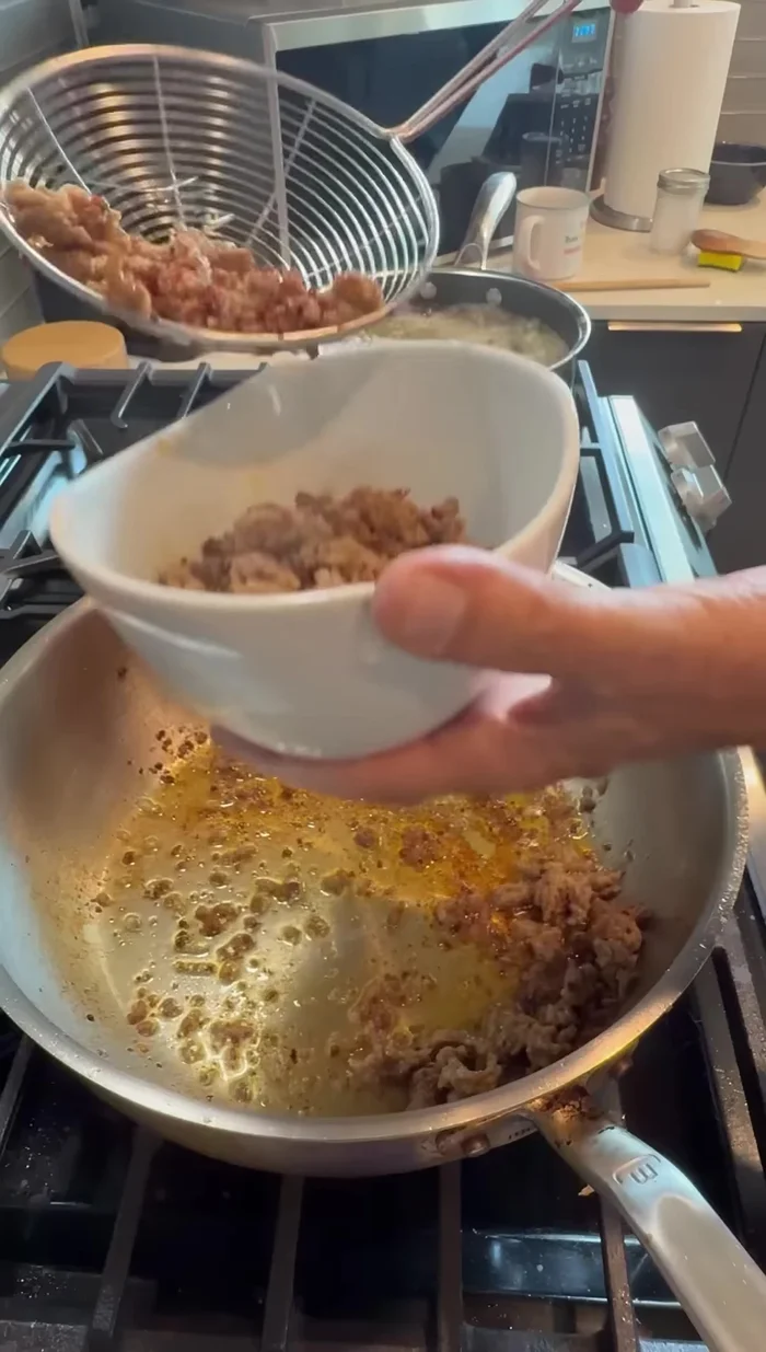 Remove the cooked sausage from the pan, leaving the fond (browned bits) behind.