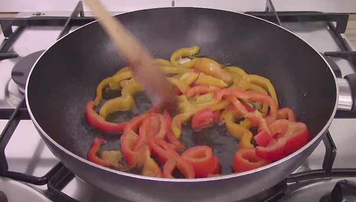 Cook the peppers for about 15 minutes until soft. Remove from heat and take out the garlic and rosemary. [107.92, 116.719]