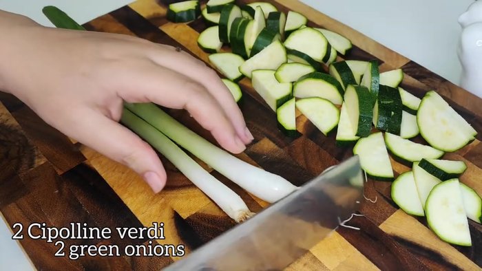 Preheat oven and prepare zucchini (washing, slicing, etc.)