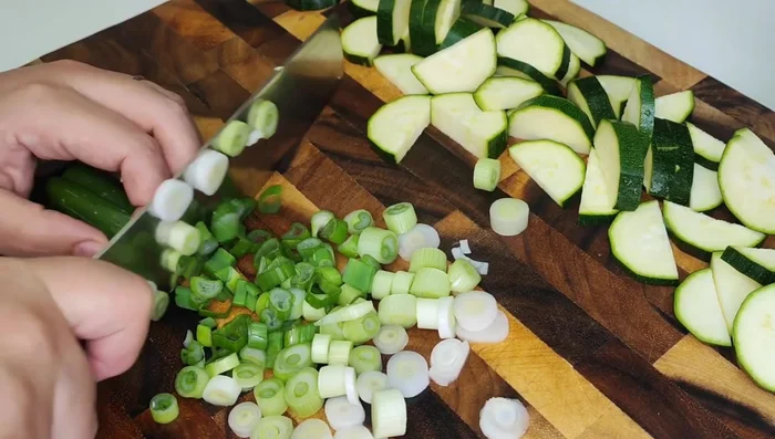 Season the zucchini slices with olive oil, salt, pepper, and any other desired seasonings.