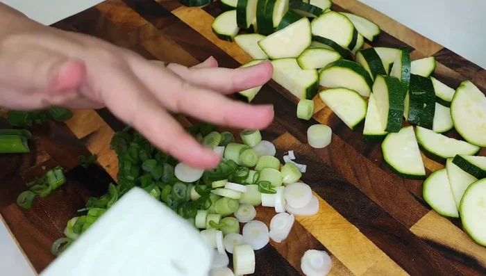 Arrange zucchini slices on a baking sheet.