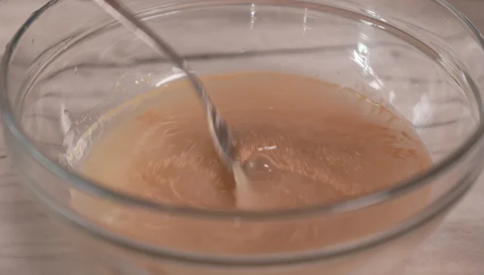 Make the preferment (polish): Dissolve 3g dry yeast and 5g honey in 300ml room temperature water. Add 300g flour and mix roughly. Cover and let rise for 2 hours or until doubled.