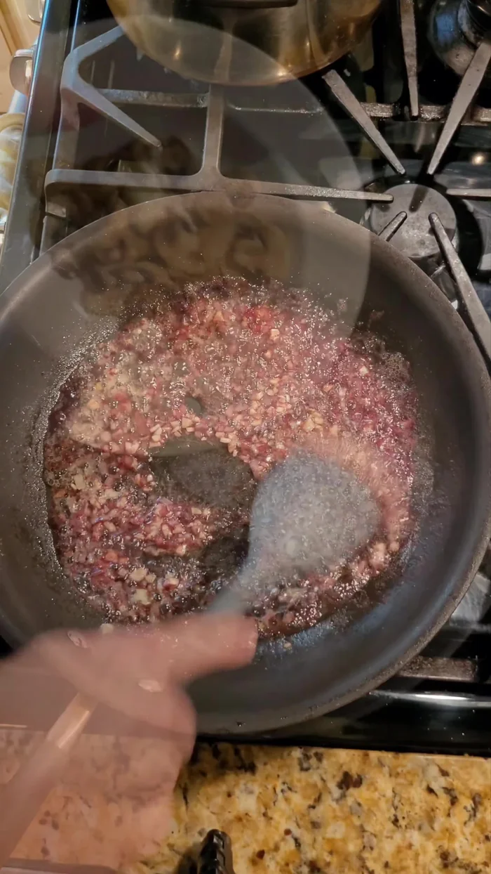 Add the cooked mushrooms, stir, and reduce heat to low.