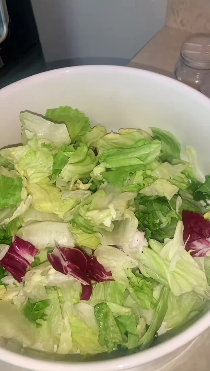 Slice and add one whole avocado to the bowl.