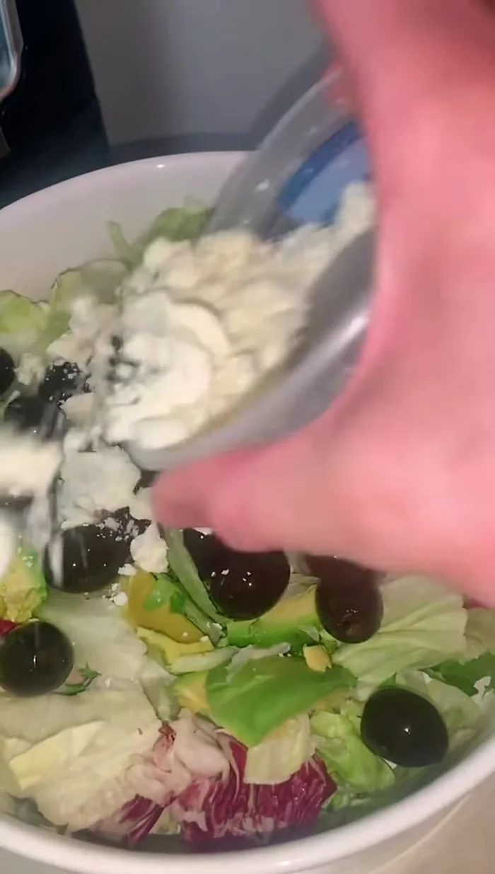 Sprinkle feta cheese over the salad.