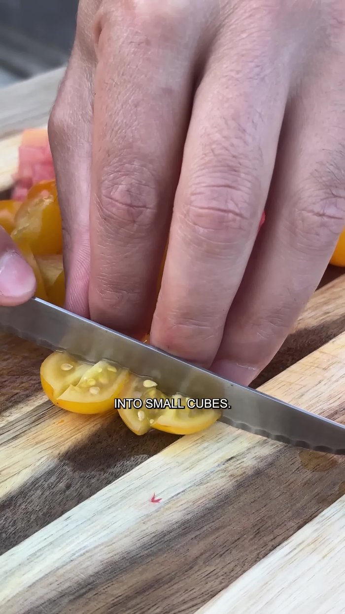 Add all the tomatoes to a bowl.