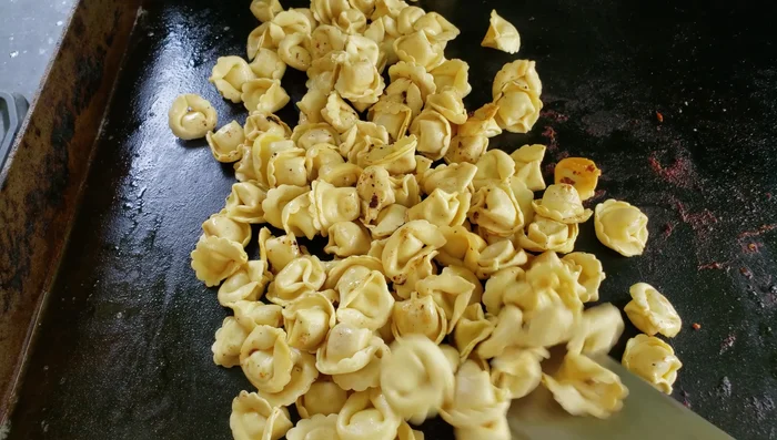 Cook tortellini until al dente, stirring occasionally.