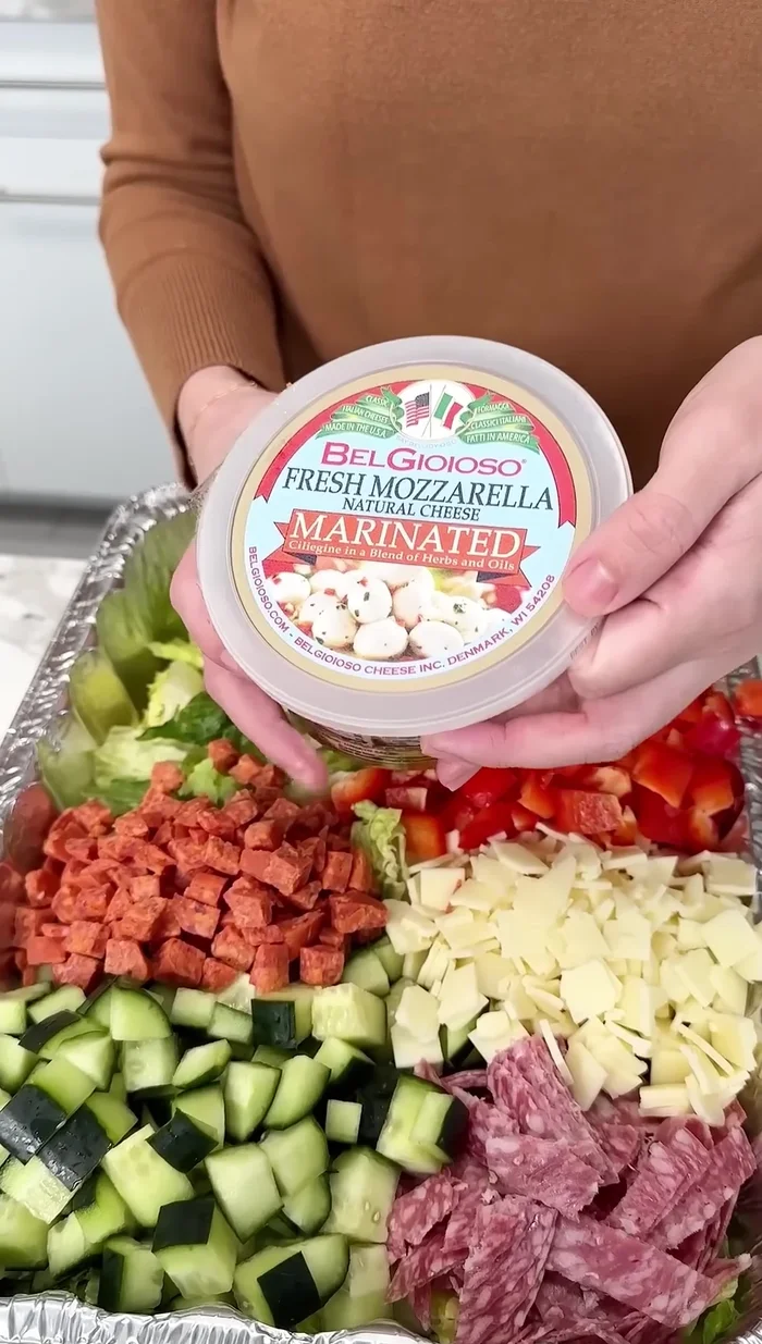 Add marinated mozzarella balls.