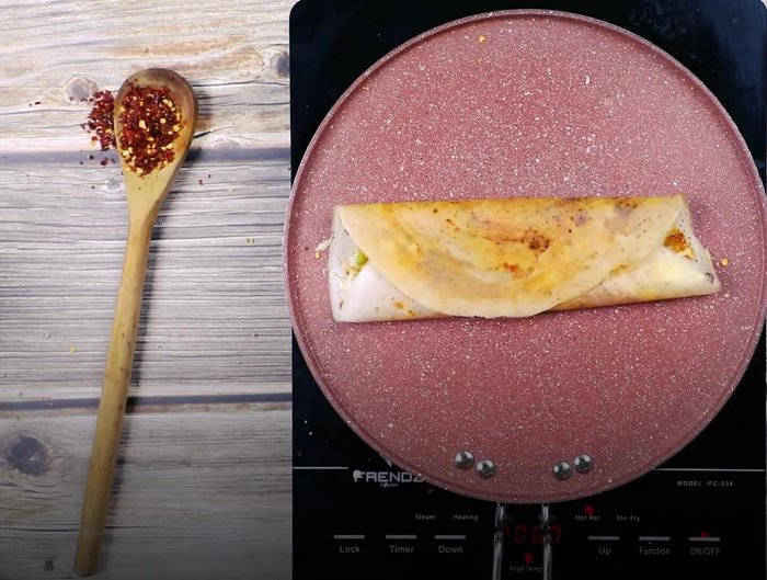 Fold the dosa like a calzone and serve with chutney.