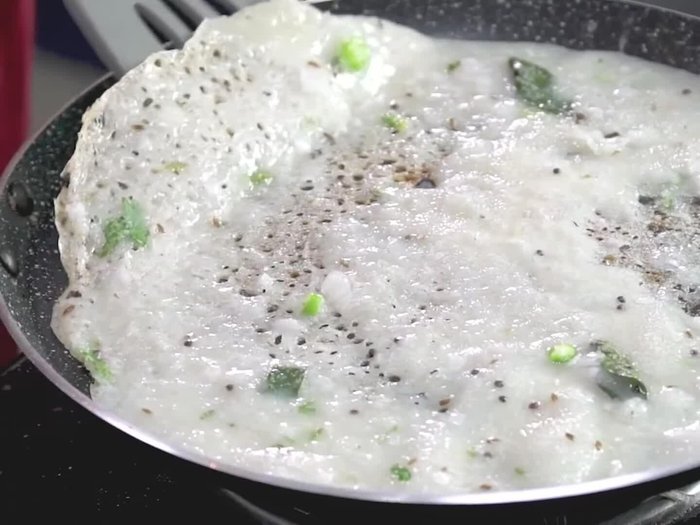For the Rava Onion Dosa: In a bowl, combine semolina, rice flour, and maida. Add buttermilk, salt, and water to make a thin batter.