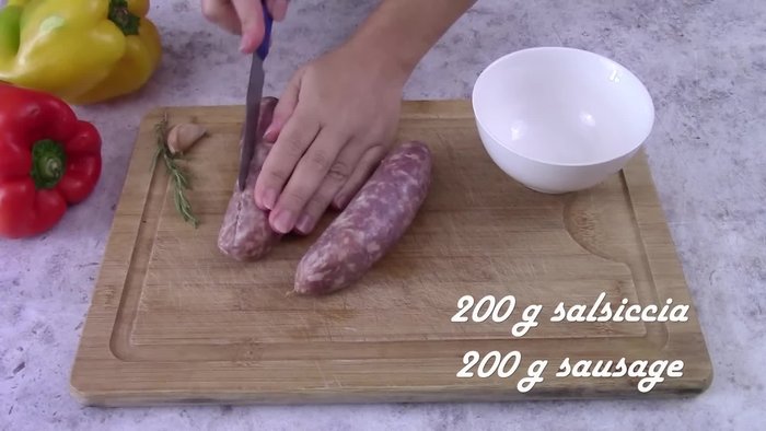 Prepare ingredients: Remove sausage skin and crumble. Cut peppers in half, remove seeds and filaments, then slice.