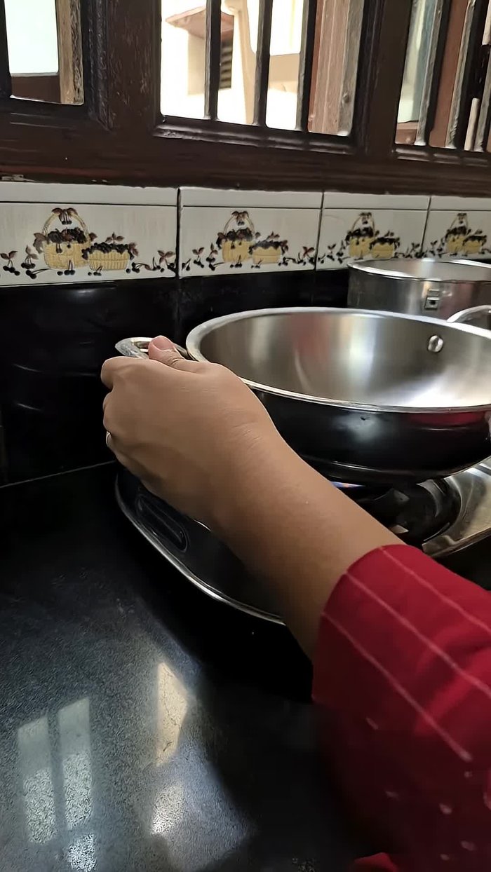Make the pizza sauce: In a pan, sauté chopped onions and crushed garlic in oil. Add the puree of four small (or two large) tomatoes.